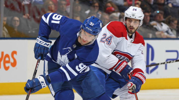 TORONTO, ON - FEBRUARY 23: Phillip Danault #24 of the Montreal Canadiens keeps a close check on John Tavares #91 of the Toronto Maple Leafs in an NHL game at Scotiabank Arena on February 23, 2019 in Toronto, Ontario, Canada. The Maple Leafs defeated the Canadiens 6-3. (Photo by Claus Andersen/Getty Images)