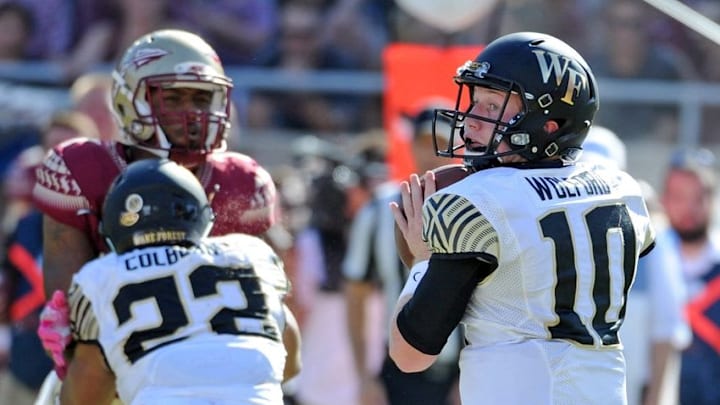 Oct 15, 2016; Tallahassee, FL, USA; Florida State Seminoles defense tries to pressure Wake Forest Demon Deacons quarterback John Wolford (10) during the game at Doak Campbell Stadium. Mandatory Credit: Melina Vastola-USA TODAY Sports