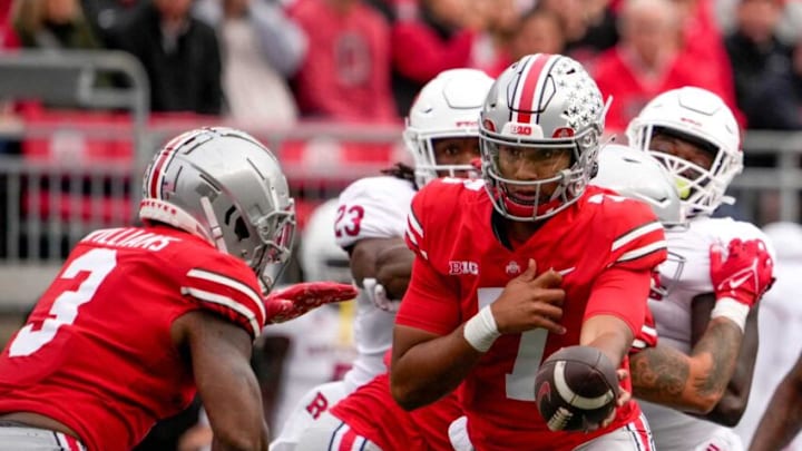 Oct 1, 2022; Columbus, Ohio, USA; Ohio State Buckeyes quarterback C.J. Stroud (7) passes off the ball to Ohio State Buckeyes running back Miyan Williams (3) during the second quarter of the NCAA Division I football game between the Ohio State Buckeyes and the Rutgers Scarlet Knights at Ohio Stadium. Mandatory Credit: Joseph Scheller-The Columbus DispatchNcaa Football Rutgers Scarlet Knights At Ohio State Buckeyes