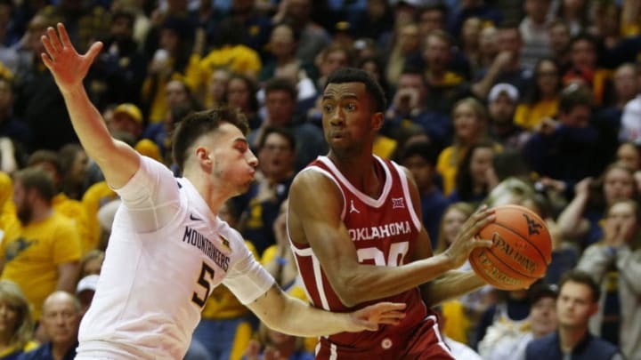 MORGANTOWN, WV - FEBRUARY 29: Jamal Bieniemy #24 of the Oklahoma Sooners drives against Jordan McCabe #5 of the West Virginia Mountaineers at the WVU Coliseum on February 29, 2020 in Morgantown, West Virginia. (Photo by Justin K. Aller/Getty Images)