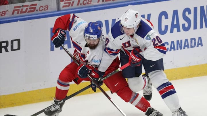 BUFFALO, NY - JANUARY 05: Marek Zachar #6 of Czech Republic battles with Andrew Peeke #20 of United States during the second period of play in the IIHF World Junior Championships Bronze Medal game at KeyBank Center on January 5, 2018 in Buffalo, New York. (Photo by Nicholas T. LoVerde/Getty Images)