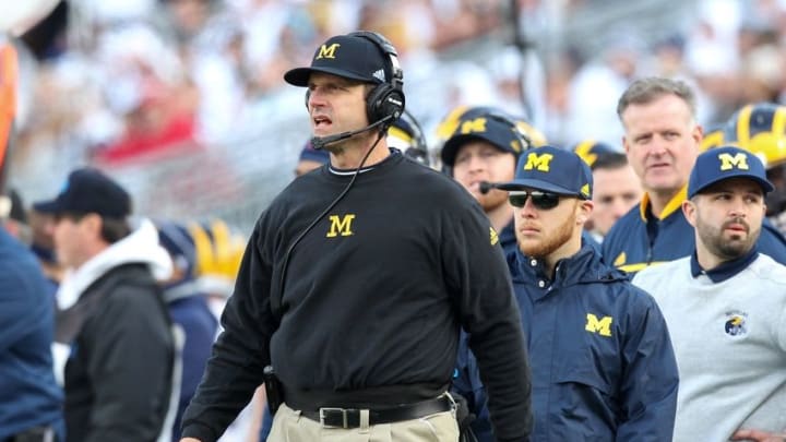 Nov 21, 2015; University Park, PA, USA; Michigan Wolverines head coach Jim Harbaugh looks on from the sideline during the fourth quarter against the Penn State Nittany Lions at Beaver Stadium. Michigan defeated Penn State 28-16. Mandatory Credit: Matthew O