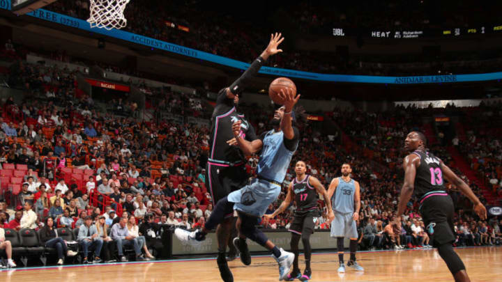 MIAMI, FL - JANUARY 12: Mike Conley #11 of the Memphis Grizzlies goes to the basket against the Miami Heat on January 12, 2019 at American Airlines Arena in Miami, Florida. NOTE TO USER: User expressly acknowledges and agrees that, by downloading and/or using this photograph, user is consenting to the terms and conditions of the Getty Images License Agreement. Mandatory Copyright Notice: Copyright 2019 NBAE (Photo by Issac Baldizon/NBAE via Getty Images)