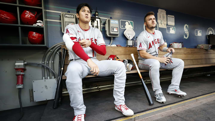 SEATTLE, WASHINGTON – JUNE 16: Shohei Ohtani #17 and Mike Trout #27 of the Los Angeles Angels look on before the game against the Seattle Mariners at T-Mobile Park on June 16, 2022 in Seattle, Washington. Are they a threat to the Yankees? (Photo by Steph Chambers/Getty Images)