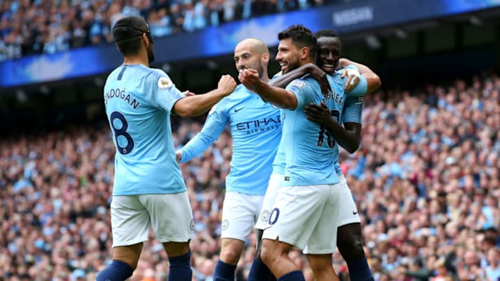 MANCHESTER, ENGLAND - AUGUST 19: Sergio Aguero of Manchester City celebrates with teammates after scoring his team's third goal during the Premier League match between Manchester City and Huddersfield Town at Etihad Stadium on August 19, 2018 in Manchester, United Kingdom. (Photo by Alex Livesey/Getty Images)