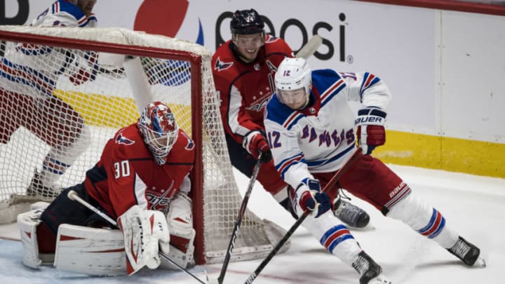 Mar 28, 2021; Washington, District of Columbia, USA; New York Rangers right wing Julien Gauthier (12) attempts a wrap around against Washington Capitals goaltender Ilya Samsonov (30) during the third period at Capital One Arena. Mandatory Credit: Scott Taetsch-USA TODAY Sports