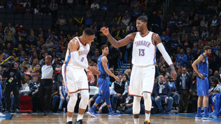 OKLAHOMA CITY, OK - NOVEMBER 12: Russell Westbrook #0 and Paul George #13 of the OKC Thunder high five during the game against the Dallas Mavericks on November 12, 2017 at Chesapeake Energy Arena in Oklahoma City, Oklahoma. Copyright 2017 NBAE (Photo by Layne Murdoch/NBAE via Getty Images)
