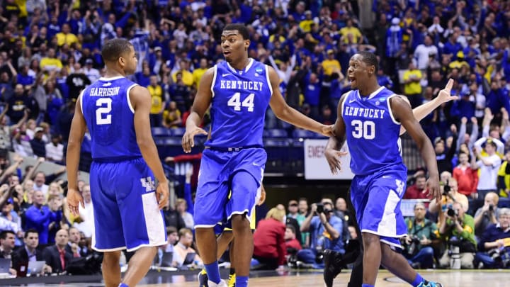 Mar 30, 2014; Indianapolis, IN, USA; Kentucky Wildcats guard Aaron Harrison (2) is congratulated by teammates Dakari Johnson (44) and Julius Randle (30) after making the game-winning three-point shot in the second half of the finals of the midwest regional of the 2014 NCAA Mens Basketball Championship tournament against the Michigan Wolverines at Lucas Oil Stadium. Mandatory Credit: Bob Donnan-USA TODAY Sports