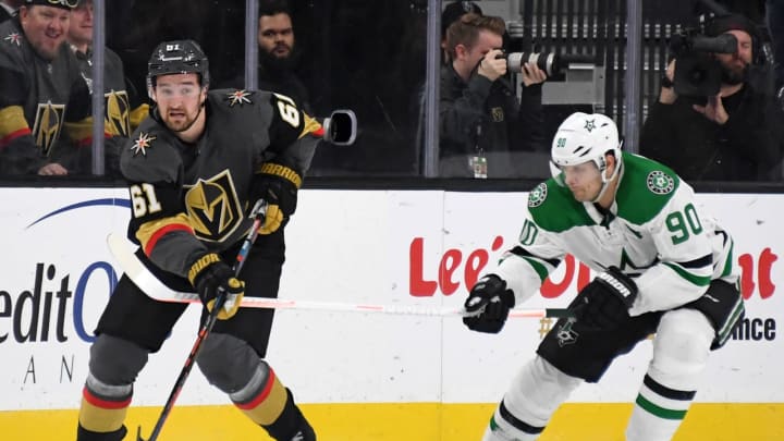 Mark Stone #61 of the Vegas Golden Knights passes the puck under pressure.