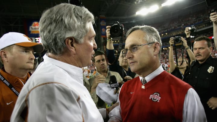 GLENDALE, AZ – JANUARY 05: Head coach Jim Tressel of the Ohio State Buckeyes greets Mack Brown of the Texas Longhorns after the Tostitos Fiesta Bowl Game on January 5, 2009 at University of Phoenix Stadium in Glendale, Arizona. The Longhorns defeated the Buckeyes 24-21. (Photo by Doug Pensinger/Getty Images)