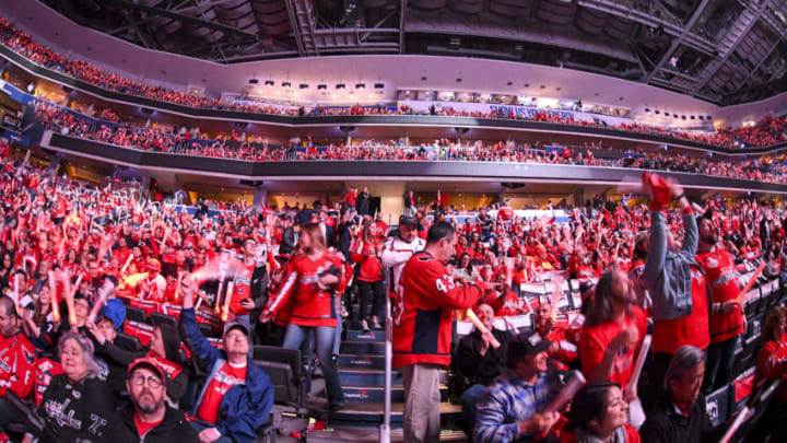 WASHINGTON, DC - APRIL 11: Washington Capitals fans stand prior to the game against the Carolina Hurricanes on April 11, 2019, at the Capital One Arena in Washington, D.C. in the first round of the Stanley Cup Playoffs. (Photo by Mark Goldman/Icon Sportswire via Getty Images)