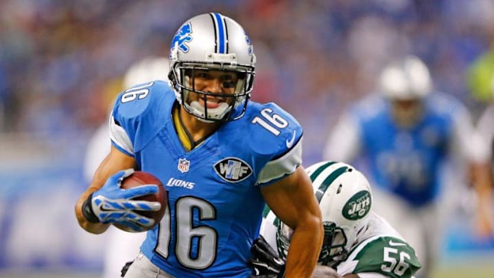 DETROIT, MI - AUGUST 13: Lance Moore #16 of the Detroit Lions runs for a first down as Demario Davis #56 of the New York Jets attempts to make the stop during the first quarter of the preseason game on August 13, 2015 at Ford Field Detroit, Michigan. (Photo by Leon Halip/Getty Images)