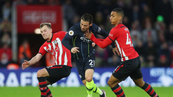 SOUTHAMPTON, ENGLAND - DECEMBER 30: David Silva of Manchester City battles with James Ward-Prowse of Southampton and Yan Valery of Southampton during the Premier League match between Southampton FC and Manchester City at St Mary's Stadium on December 29, 2018 in Southampton, United Kingdom. (Photo by Catherine Ivill/Getty Images)