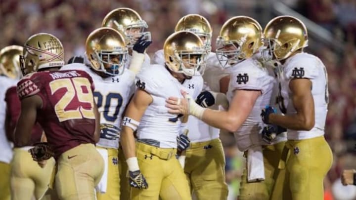 Oct 18, 2014; Tallahassee, FL, USA; Notre Dame Fighting Irish wide receiver William Fuller (7) celebrates with teammates after scoring a touchdown in the third quarter agains the Florida State Seminoles at Doak Campbell Stadium. Mandatory Credit: Matt Cashore-USA TODAY Sports