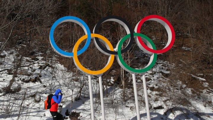 PYEONGCHANG-GUN, SOUTH KOREA - FEBRUARY 04: A skier goes past the Olympic rings at the Jeongseon Alpine Centre prior to the PyeongChang 2018 Winter Olympic Games on February 4, 2018 in Pyeongchang-gun, South Korea. (Photo by Ezra Shaw/Getty Images)