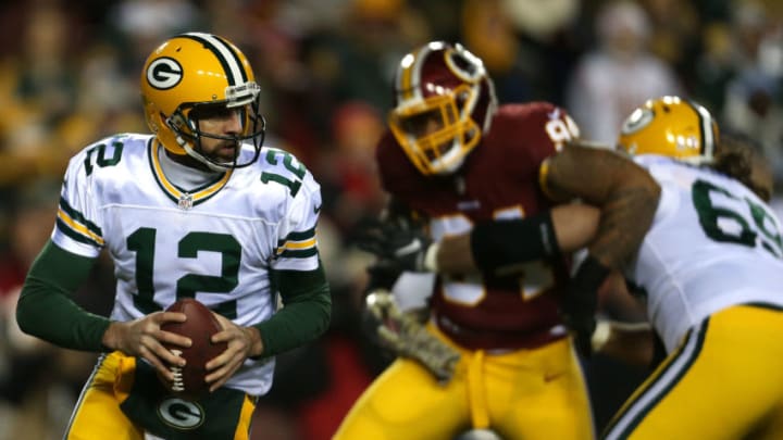 LANDOVER, MD - NOVEMBER 20: Quarterback Aaron Rodgers #12 of the Green Bay Packers looks to pass while teammate tackle David Bakhtiari #69 blocks against outside linebacker Preston Smith #94 of the Washington Redskins in the first quarter at FedExField on November 20, 2016 in Landover, Maryland. (Photo by Matt Hazlett/Getty Images)