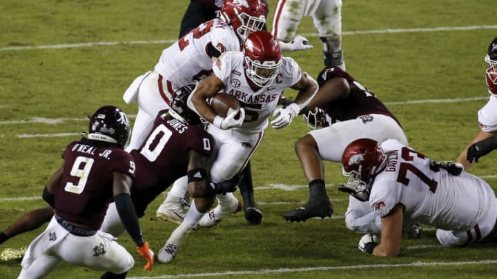 COLLEGE STATION, TEXAS - OCTOBER 31: Rakeem Boyd #5 of the Arkansas Razorbacks is tackled by Myles Jones #0 of the Texas A&M Aggies in the third quarter at Kyle Field on October 31, 2020 in College Station, Texas. (Photo by Tim Warner/Getty Images)