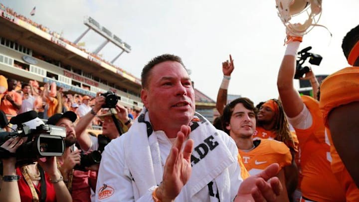 Jan 1, 2016; Tampa, FL, USA; Tennessee Volunteers head coach Butch Jones and teammates celebrate as they beat the Northwestern Wildcats in the 2016 Outback Bowl at Raymond James Stadium. Tennessee Volunteers defeated the Northwestern Wildcats 45-6. Tennessee Volunteers Mandatory Credit: Kim Klement-USA TODAY Sports
