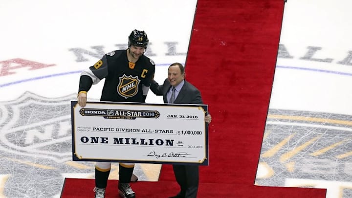 Jan 31, 2016; Nashville, TN, USA; Pacific Division forward John Scott (28) of the Montreal Canadiens stands with NHL Commissioner Gary Bettman after the 2016 NHL All Star Game at Bridgestone Arena. Mandatory Credit: Aaron Doster-USA TODAY Sports
