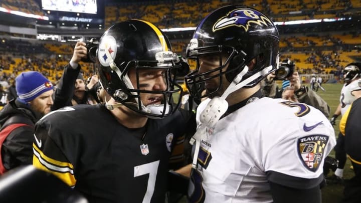 Jan 3, 2015; Pittsburgh, PA, USA; Pittsburgh Steelers quarterback Ben Roethlisberger (7) talks to Baltimore Ravens quarterback Joe Flacco (5) after their 2014 AFC Wild Card playoff football game at Heinz Field. The Ravens won 30-17. Mandatory Credit: Charles LeClaire-USA TODAY Sports