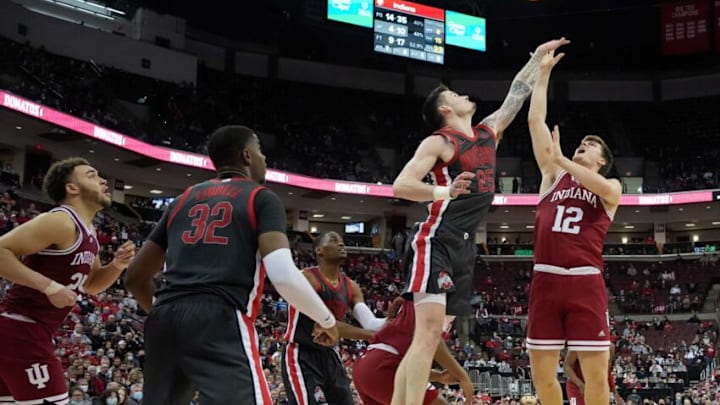 Indiana Hoosiers forward Miller Kopp (12) is guarded by Ohio State Buckeyes forward Kyle Young (25) during the second half of Monday's NCAA Division I basketball game at Value City Arena in Columbus, Oh., on February 21, 2022. The Buckeyes won the game 80-69 in overtime.Ceb Osumbk 0220 Bjp 20