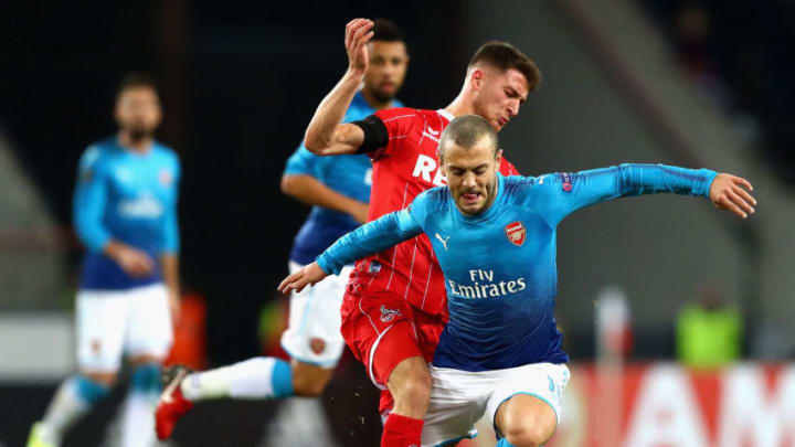 COLOGNE, GERMANY - NOVEMBER 23: Jorge Mere of FC Koeln tackles Jack Wilshere of Arsenal during the UEFA Europa League group H match between 1. FC Koeln and Arsenal FC at RheinEnergieStadion on November 23, 2017 in Cologne, Germany. (Photo by Dean Mouhtaropoulos/Getty Images)