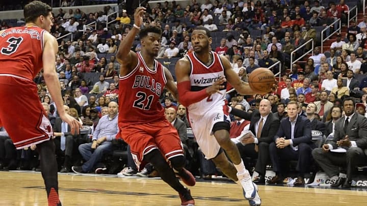 Mar 16, 2016; Washington, DC, USA; Washington Wizards guard John Wall (2) drive to the basket as Chicago Bulls guard Jimmy Butler (21) defends during the second half at Verizon Center. Washington defeated Chicago 117-96. Mandatory Credit: Tommy Gilligan-USA TODAY Sports