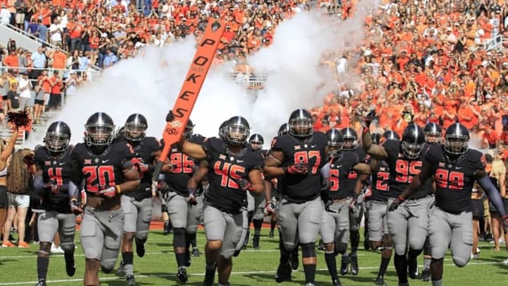 Sep 10, 2016; Stillwater, OK, USA; The Oklahoma State Cowboys run onto the field before the start of a game against the Central Michigan Chippewas during the first quarter at Boone Pickens Stadium. Mandatory Credit: Alonzo Adams-USA TODAY Sports