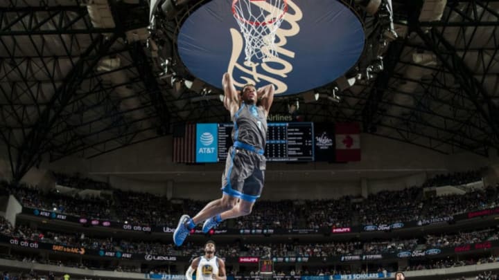 DALLAS, TX - NOVEMBER 17: Dennis Smith Jr. #1 of the Dallas Mavericks dunks the ball against the Golden State Warriors on November 17, 2018 at the American Airlines Center in Dallas, Texas. NOTE TO USER: User expressly acknowledges and agrees that, by downloading and/or using this photograph, user is consenting to the terms and conditions of the Getty Images License Agreement. Mandatory Copyright Notice: Copyright 2018 NBAE (Photo by Glenn James/NBAE via Getty Images)