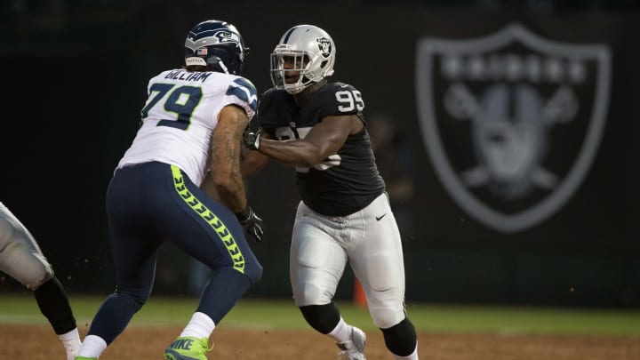 September 1, 2016; Oakland, CA, USA; Oakland Raiders defensive end Jihad Ward (95) rushes against Seattle Seahawks tackle Garry Gilliam (79) during the first quarter at Oakland Coliseum. Mandatory Credit: Kyle Terada-USA TODAY Sports