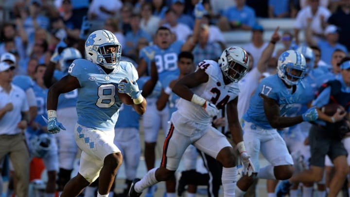 CHAPEL HILL, NC – OCTOBER 14: Michael Carter #8 of the North Carolina Tar Heels breaks free for a long run during their against the Virginia Cavaliers game at Kenan Stadium on October 14, 2017 in Chapel Hill, North Carolina. Virginia won 20-14. (Photo by Grant Halverson/Getty Images)