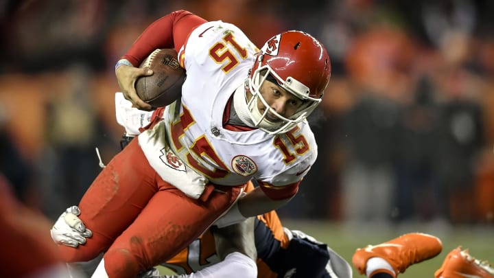 On the game’s final drive, Kansas City Chiefs quarterback Patrick Mahomes (15) leans forward for yardage on a quarterback run against the Denver Broncos on Sunday, Dec. 31, 2017, at Sports Authority Field in Denver. The Chiefs won, 27-24. (David Eulitt/Kansas City Star/TNS via Getty Images)