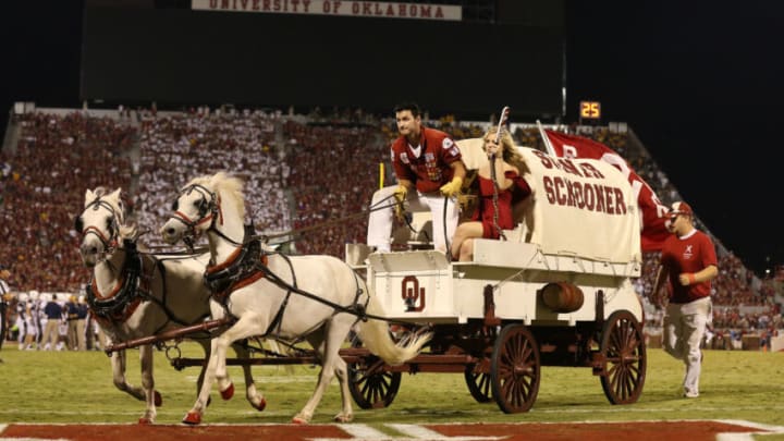 Sep 7, 2013; Norman, OK, USA; Oklahoma Sooners Schooner takes the field after a field goal was scored in the second half against West Virginia Mountaineers safety Karl Joseph (8) at Gaylord Family - Oklahoma Memorial Stadium. The Oklahoma Sooners beat the West Virginia Mountaineers 16-7. Mandatory Credit: Matthew Emmons-USA TODAY Sports