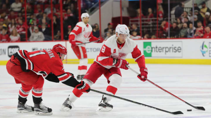 RALEIGH, NC - NOVEMBER 10: Carolina Hurricanes center Lucas Wallmark (71) and Detroit Red Wings left wing Justin Abdelkader (8) during the 2nd period of the Carolina Hurricanes game versus the Detroit Red Wings on November 10, 2018 at PNC Arena in Raleigh, NC. (Photo by Jaylynn Nash/Icon Sportswire via Getty Images)