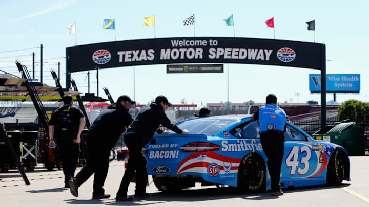 FORT WORTH, TX - APRIL 07: Crew members push the