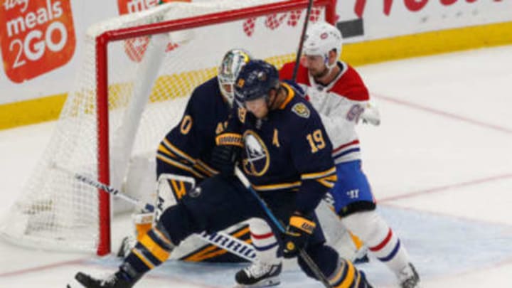 BUFFALO, NY – OCTOBER 09: Jake McCabe #19 of the Buffalo Sabres blocks a shot with Tomas Tatar #90 of the Montreal Canadiens looking for the rebound in front of Carter Hutton #40 of the Buffalo Sabres during the third period at KeyBank Center on October 9, 2019 in Buffalo, New York. (Photo by Nicholas T. LoVerde/Getty Images)