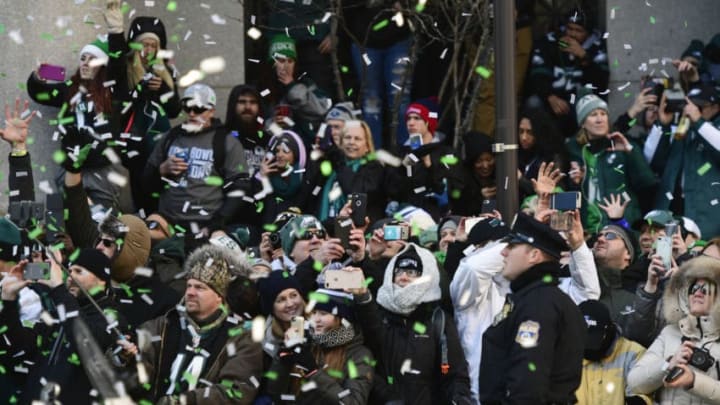 PHILADELPHIA, PA - FEBRUARY 08: Eagles fans watch busses carrying the Philadelphia Eagles team pass by during festivities on February 8, 2018 in Philadelphia, Pennsylvania. The city celebrated the Philadelphia Eagles' Super Bowl LII championship with a victory parade. (Photo by Corey Perrine/Getty Images)
