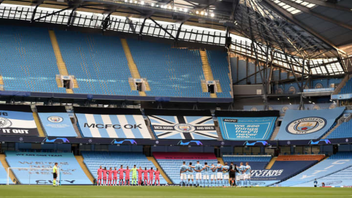 MANCHESTER, ENGLAND - AUGUST 07: General view inside the stadium as Manchester City and Real Madrid players observe a minutes silence in respect for those who have lost their lives to COVID-19 prior to the UEFA Champions League round of 16 second leg match between Manchester City and Real Madrid at Etihad Stadium on August 07, 2020 in Manchester, England. (Photo by Peter Powell/Pool via Getty Images)