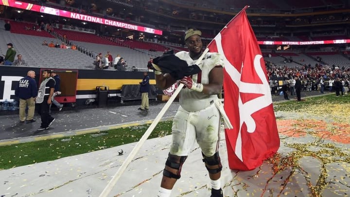 Jan 11, 2016; Glendale, AZ, USA; Alabama Crimson Tide offensive lineman Alphonse Taylor (50) celebrates after beating the Clemson Tigers in the 2016 CFP National Championship at University of Phoenix Stadium. Mandatory Credit: Matt Kartozian-USA TODAY Sports