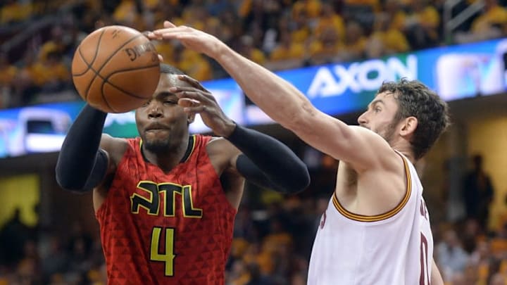 May 2, 2016; Cleveland, OH, USA; Cleveland Cavaliers forward Kevin Love (0) defends Atlanta Hawks forward Paul Millsap (4) during the second half in game one of the second round of the NBA Playoffs at Quicken Loans Arena. The Cavs won 104-93. Mandatory Credit: Ken Blaze-USA TODAY Sports