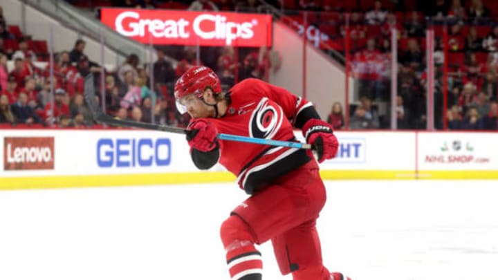 RALEIGH, NC – NOVEMBER 18: Dougie Hamilton #19 of the Carolina Hurricanes shoots the puck during an NHL game against the New Jersey Devils on November 18, 2018 at PNC Arena in Raleigh, North Carolina. (Photo by Gregg Forwerck/NHLI via Getty Images)