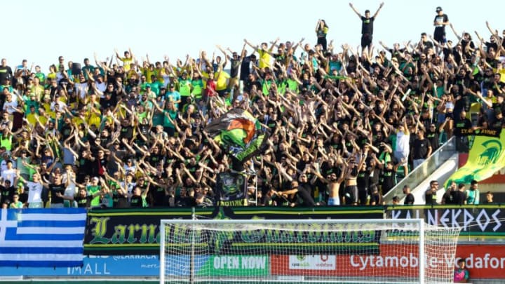 AEK Larnaca's fans cheer in the stands during the Champions League qualifying football match between Cyprus' AEK Larnaca and Denmark's Midtjylland at the AEK Arena in the southern coastal city of Larnaca on July 26, 2022. (Photo by AFP) (Photo by -/AFP via Getty Images)