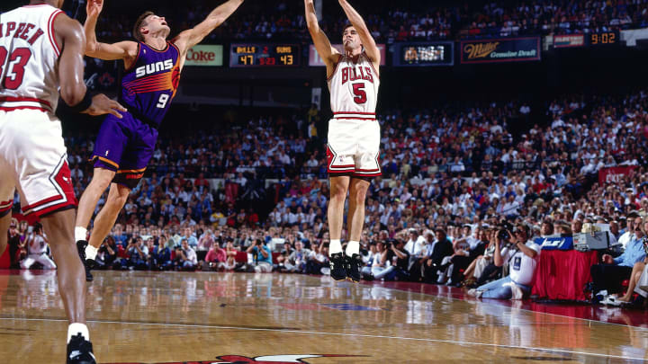 CHICAGO – JUNE 16: John Paxson #5 of the Chicago Bulls takes a jumper against the Phoenix Suns during Game Four of the 1993 NBA Championship Finals at Chicago Stadium on June 16, 1993 in Chicago, Illinois. Chicago won 111-105, making the Series 3-1, Chicago. NOTE TO USER: User expressly acknowledges and agrees that, by downloading and/or using this Photograph, User is consenting to the terms and conditions of the Getty Images License Agreement. Mandatory copyright notice: Copyright 1993 NBAE. (Photo by Nathaniel S. Butler/NBAE/Getty Images)