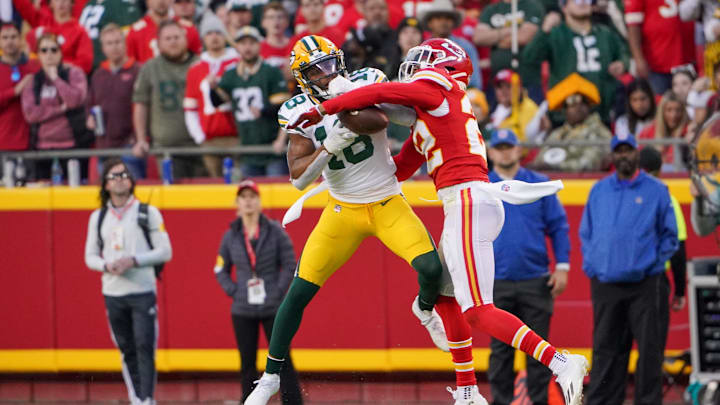 Nov 7, 2021; Kansas City, Missouri, USA; Green Bay Packers wide receiver Randall Cobb (18) catches a pass as Kansas City Chiefs safety Juan Thornhill (22) defends during the first half at GEHA Field at Arrowhead Stadium. Mandatory Credit: Denny Medley-USA TODAY Sports