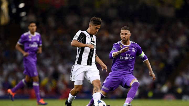 CARDIFF, WALES - JUNE 03: Paulo Dybala of Juventus and Sergio Ramos of Real Madrid battle for possession during the UEFA Champions League Final between Juventus and Real Madrid at National Stadium of Wales on June 3, 2017 in Cardiff, Wales. (Photo by David Ramos/Getty Images)