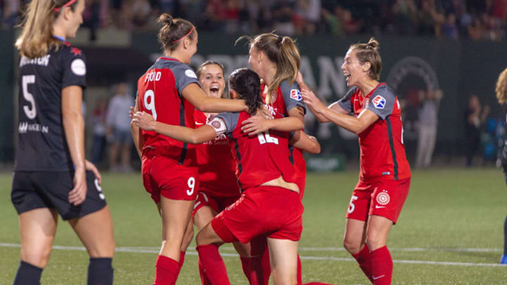 PORTLAND, OR - AUGUST 18, 2018: Portland Thorns celebrate their second goal of the evening by forward Christine Sinclair during the Chicago Red Stars 2-2 tie with the Portland Thorns on August 18, 2018, at Providence Park, Portland, Oregon (Photo by Diego Diaz/Icon Sportswire via Getty Images).