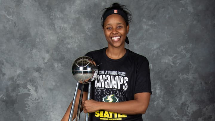 WASHINGTON D.C – SEPTEMBER 12: Noelle Quinn #45 of the Seattle Storm poses with the 2018 WNBA Championship trophy after defeating the Washington Mystics in Game Three of the 2018 WNBA Finals on September 12, 2018 at George Mason University in Washington D.C. Copyright 2018 NBAE (Photo by Ned Dishman/NBAE via Getty Images)