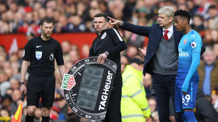 MANCHESTER, ENGLAND - APRIL 29: Arsene Wenger, Manager of Arsenal speaks with Joseph Willock of Arsenal prior to being subtituted on during the Premier League match between Manchester United and Arsenal at Old Trafford on April 29, 2018 in Manchester, England. (Photo by Shaun Botterill/Getty Images)