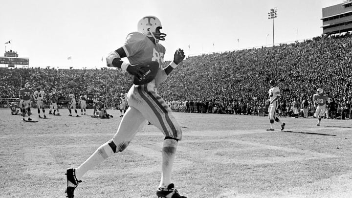 Tennessee wingback Lester McClain (85) runs through the back of the end zone after catching a 12-yard touchdown pass from Bobby Scott against Florida during the 25th annual Gator Bowl Dec. 27, 1969. A record crowd of 72,248 watch Florida upset the SEC champion Vols 14-13.69then12 055