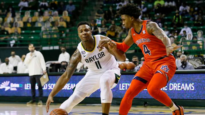 Jan 30, 2021; Waco, Texas, USA; Baylor Bears guard Mark Vital (11) looks for space against Auburn Tigers forward Javon Franklin (4) during the first half at Ferrell Center. Mandatory Credit: Raymond Carlin III-USA TODAY Sports
